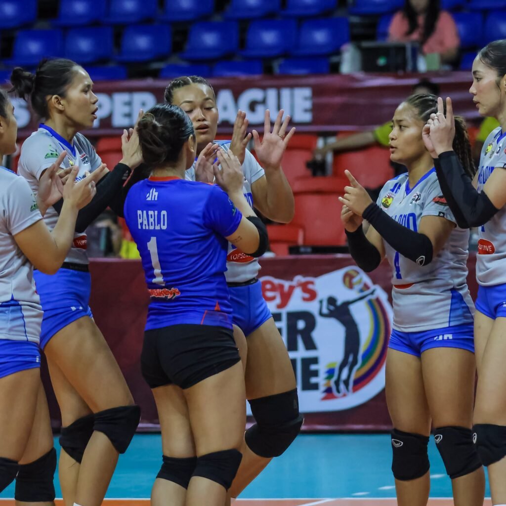 Arellano University players celebrate during their Shakey’s Super League match against Perpetual Help System DALTA.